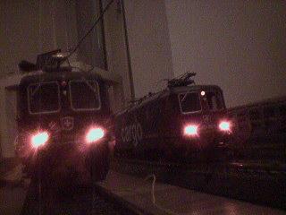 Two beautiful locomotives with powerful lights.